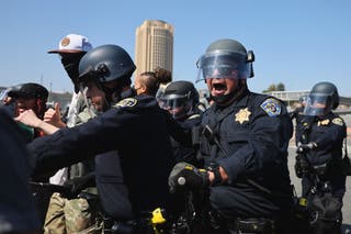 Police move to protesters who tried to take over the 101 highway during protests lit by immigration raids in Los Angeles